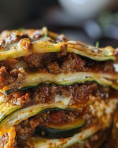 several slices of zucchini stacked on top of each other with meat and cheese