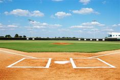 an empty baseball field with the batter ready to swing