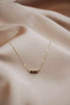 This is a simple yet sophisticated piece that he be worn on its own or layered with additional necklaces. Materials: 14k Gold Fil Measurements: 16" or 18" chain, .25" Pendant Dot Necklace, Three Dots, Muse, Gold Filled, Silver Necklace, Dots, Necklaces, Sterling Silver, Chain