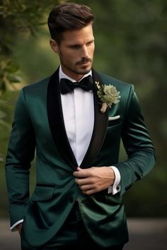 a man in a green tuxedo with a black lapel and white bow tie