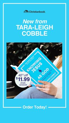 a woman holding a blue book with the title new from tara - leigh cobble