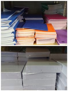 several stacks of papers are stacked on top of each other in different colors and sizes