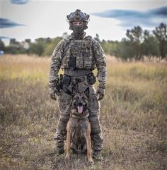 a soldier with his dog in the field