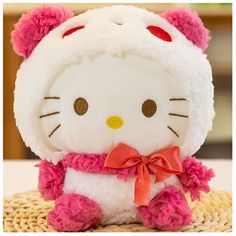 a hello kitty stuffed animal sitting on top of a table