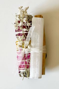 a wrapped present sitting on top of a wooden board