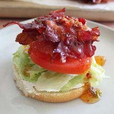 a bacon, lettuce and tomato sandwich on a white plate