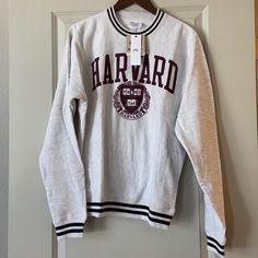 a harvard sweatshirt hanging on a door hanger