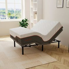 a mattress is sitting on top of a bed frame in the corner of a room