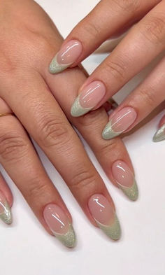 sage green nails: glittery French tips Iridescent French Tip Nails Almond, Simple Short Nail Designs Green, Bridal Nails Sage Green, Sage Green Nails With Glitter, Cute Sage Green Nails Short, Sage Nails Ideas, Prom Nails Light Green, Green Blush Nails, Nails To Match Sage Green Dress