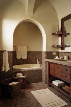 A soft cream bathroom with brown cabinetry and accents, offering a classic and timeless design. Cream And Brown Bathroom, Bathroom Inspiration, Bathrooms