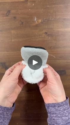 a person is holding a sponge and cleaning it on the floor with their thumbnails