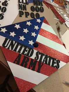 the united states army cap is made out of glitter paper and has an american flag on it