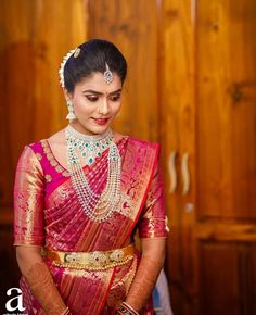 a woman in a red and gold sari