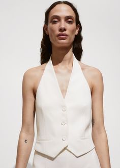 Cropped design. Straight design. Halter neck. Sleeveless. Two welt pockets on the front. Front button closure. Inner lining White Ribbed Top, Black Waistcoat, Halter Vest, Waistcoat Woman, Women's Coats & Jackets, Blazers For Women, White Long Sleeve, Welt Pockets, Halter Neck