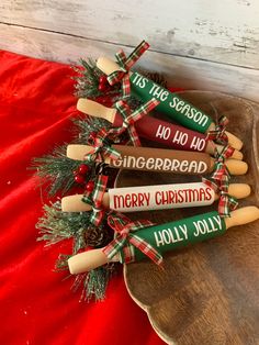 christmas crackers are arranged on a wooden platter