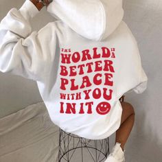 The World Is A Better Place Hoodie from LB gives you the power of positive affirmations all in one cozy pullover. This classic hoodie is complete with a drawcord hood, kangaroo pocket, long sleeves, and "the world is a better place with you in it" graphic on the back. Pullover sweatshirt Drawcord hood Long sleeves Kangaroo pocket Back graphic It Hoodie, Quote Graphic, Hoodie Quotes, Hoodie Aesthetic, Sweatshirt Trendy, Graphic Quotes