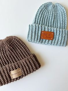 two knitted hats sitting next to each other