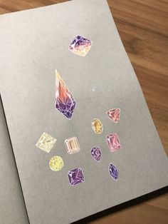 several different colored diamonds on a piece of paper