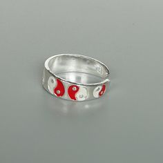 A sterling silver toe ring enameled with a red and white yin yang design. 5mm wide. This is an open ended toe ring and can be adjusted to fit most feet. These toe rings are made of 925 hypoallergenic sterling silver. Please note this price is for ONE toe ring only. Sent in a gift box. I can include a personal message from you if needed You are welcome to contact me at... bhavnakwintra1956@gmail.com For more beautiful pieces from my shop, please browse 👇 TOE RINGS: https://www.etsy.com/your/shop Adjustable White Toe Rings For Gift, Adjustable White Toe Rings As Gift, Nickel-free White Toe Ring Jewelry, Nickel-free White Toe Ring, White Sterling Silver Toe Rings For Gift, White Sterling Silver Toe Rings As Gift, Sterling Silver White Toe Rings As Gift, Yin Yang Designs, Sterling Silver Toe Rings