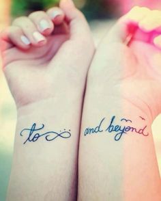 two people with tattoos on their arms and the words tattoo written in cursive writing