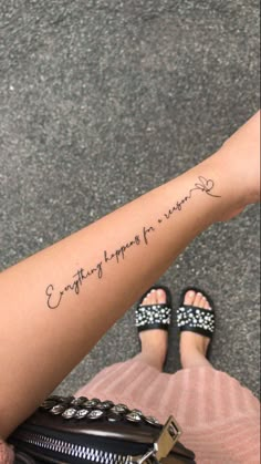 a woman's arm with the words everything happens for love written in cursive font