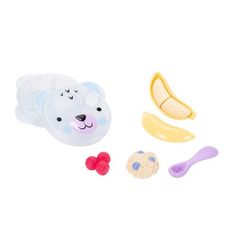 a play food set with bananas, cookies and a bear's face on it