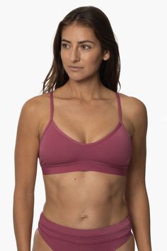 The Mara gives you the perfect hybrid sports bra + bikini top to wear for hot yoga or during a hard swim practice. Designed as a supportive bikini sports bra for athletes - the Mara can be worn at the gym or in the water. The cut out strappy detailing on the back and scooped neckline make it a flattering full coverage sports bra option. Features: Good for: Yoga, Beach Volleyball, Swim, Water Polo, Surfing, paddling, lifeguarding, ocean activities, pool activities, gym workouts Fixed-back straps Supportive Bra With Removable Pads For Pilates, Padded Triangle Top Sports Bra, Seamless Triangle Top Sports Bra, Functional Sports Bra For Swimming, Sports Bra With Padded Cups And Stretch, Yoga Bra With Adjustable T-back Straps, Yoga T-back Bra With Adjustable Straps, Sporty Fitted Triangle Top Bra, Seamless T-back Sports Bra For Yoga