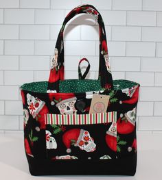 "Santa Christmas Skulls Tote Bag A wonderful surprise gift  Will be cherished Holiday after Holiday Inside Pockets have Candy Canes This item is READY to ship. Fabric Pattern May Vary for the PHOTO. Made from Quality 100% Cotton Fabric with firm interfacing to keep its shape Open Top with a Button Loop Closure Approximately    8  1/2\" High x 10\" Long x 4 1/2\" Deep Two Cotton Handles 1\" Wide a  8\" drop for over the shoulder Has a Front Slip Pocket 5 1/2\" Long x 4\" High Has 4 Inside Slip Pockets 2 on each side each 4\" x 4\" All My Items Are Made In A Smoke, Pet and Virus Free Home Looking for something Special  I make Beautiful Handmade Totes, Purses, Pouches, Coin Purses, Table Runners and Quilts" Christmas Skulls, Christmas Purse, Ship Fabric, Skull Tote Bag, Bags And Purses, Handmade Tote, Tote Bags Handmade, Handmade Handbags, Surprise Gift