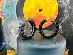 Rev up your style with our one-of-a-kind black tyre tread hoop earrings! 🖤 Perfect for the fashion-forward, these edgy accessories add a bold twist to any outfit. Elevate your look and make a statement with our unique design. Get yours now! #tyretredearrings #edgyfashion #uniquejewelry #statementearrings #blackearrings #fashionaccessories Black Round Jewelry For Streetwear, Black Hoop Earrings For Streetwear, Black Single Earring For Streetwear, Adjustable Small Hoop Earrings, Male Earrings Aesthetic, Earrings Aesthetic Silver, Mens Studs, Earrings Mens, Mens Earrings