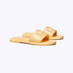 Classic Flat Slides With Removable Insole, Classic Leather Slides For Spring, Classic Spring Slides With Rubber Sole, Classic Slides With Leather Footbed For Spring, Classic Spring Slide Slides, Classic Flat Slides For Spring, Classic Leather Slides, Classic Slides With Rubber Sole, Classic Cushioned Slip-on Slides