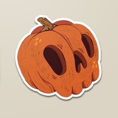 an orange pumpkin shaped sticker with holes in it