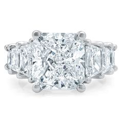 an engagement ring with three princess cut diamonds