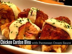 chicken cordon bleu with parmesan cream sauce in a white bowl