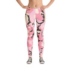 a woman in pink camo print leggings with her hands on her hips