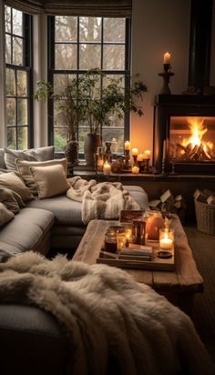 a living room filled with furniture and candles