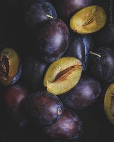 plums are shown with one cut in half