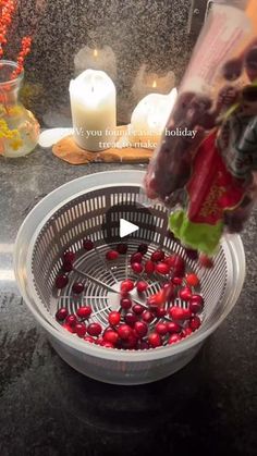 a basket filled with cranberries sitting on top of a counter