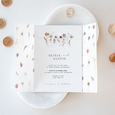 an elegant wedding suite is displayed on a plate