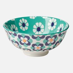 a blue and white bowl with flowers on it