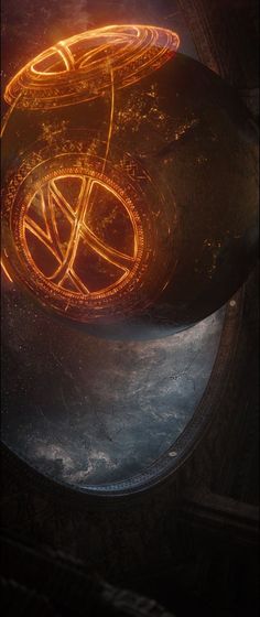 a close up of a metal object with glowing circles on it's surface and an orange glow coming from the top