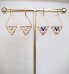 Glass beads woven onto brass triangles with gold plated ear wires Gold Triangle Beaded Bohemian Earrings, Gold Beaded Geometric Earrings, Geometric Beaded Gold Earrings, Gold Geometric Beaded Earrings, Geometric Gold Beaded Earrings, Stitch Earrings, Brick Stitch Earrings, Triangle Earrings, Brick Stitch