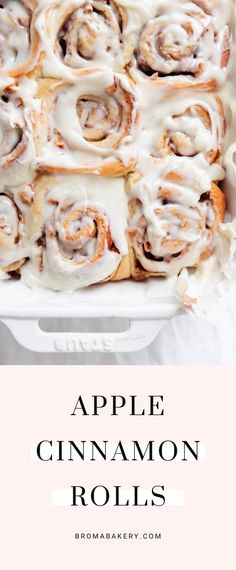 an apple cinnamon roll with icing in a white baking dish on a pink background