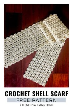 the crochet shell scarf pattern is shown on a wooden floor with text that reads,