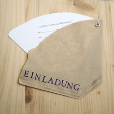 a piece of paper with the word finlading on it sitting on a wooden table