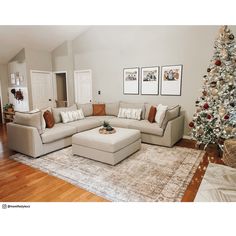 a living room filled with furniture and a christmas tree