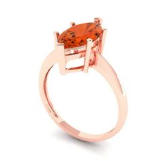 a ring with an orange stone in the center