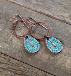 "Small patina copper teardrops with antiqued copper accent ring. Light weight, small copper teardrops with a rustic, light blue patina finish. Each pair is created individually so there may be slight variation in the finish, but will look very similar to the photo. Perfect for anyone who loves small, earthy, rustic jewelry. The patina has been sealed and will not tarnish or discolor. Product overview: - Made with copper teardrops with a light blue patina finish - The teardrop is very small, appr Bronze Copper Teardrop Earrings, Bronze Teardrop Copper Earrings, Bronze Metal Teardrop Earrings, Copper Teardrop Earrings With Patina, Vintage Teardrop Patina Earrings, Teardrop Metal Jewelry With Patina, Metal Teardrop Jewelry With Patina, Rustic Light, Patina Copper