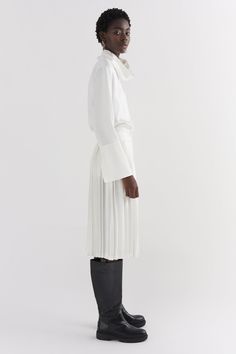 Silk Ivory contrast pleated skirt is made of 100% silk. The skirt is hand pleated in London. The skirt features two contrast pleats and a side entry invisible zip. White Evening Dress With Accordion Pleats, Elegant Long Draped Pleated Skirt, Chic Silk Skirt With Accordion Pleats, Formal White Pleated Dress, Spring Silk Skirt With Accordion Pleats, Pleated Draped Flared Skirt For Work, Elegant Pleated Flared Draped Skirt For Work, Asymmetrical Flowy Draped Pleated Skirt, Flowy Asymmetrical Draped Skirt With Pleats