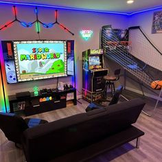 a living room filled with furniture and video games