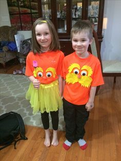 two young children wearing sesame the cat t - shirts